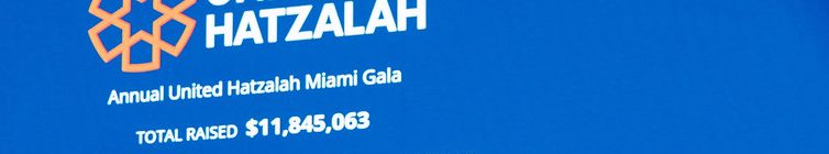 The screen at the Miami gala, December 2025: “TOTAL RAISED $11,845,063” (shown on screen at the gala; cropped to the screen)